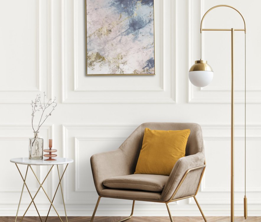 Picture frame by a velvet armchair